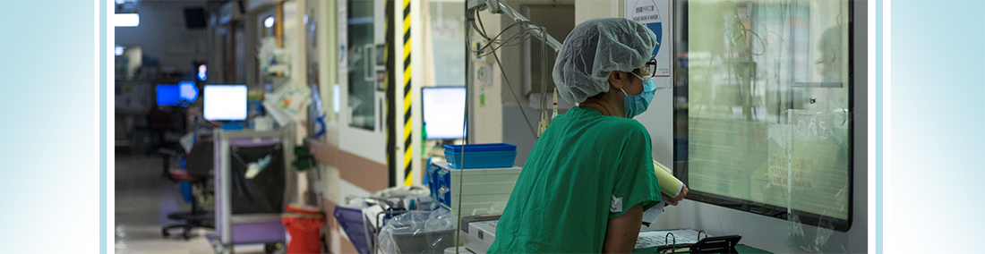 A nurse looking after a critically ill patient