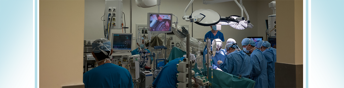 Clinical team carrying out a liver transplant surgery